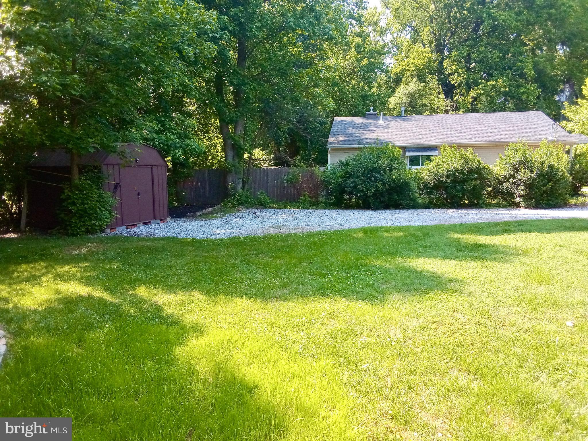 69 Oberlin Road Pennsville, NJ 08070 - Photo 18 of 21 a backyard of a house with yard and trampoline