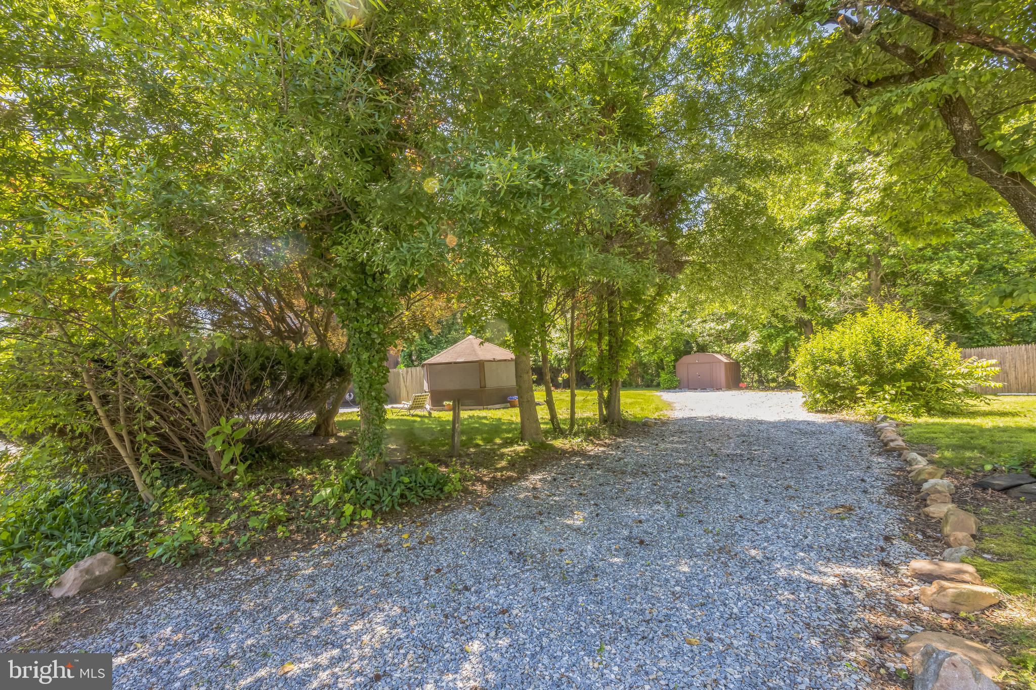 69 Oberlin Road Pennsville, NJ 08070 - Photo 21 of 21 a backyard of a house with trees and entertaining space