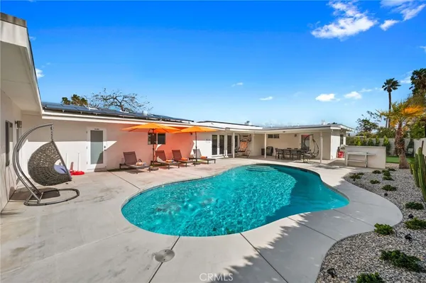 a view of a swimming pool with a patio