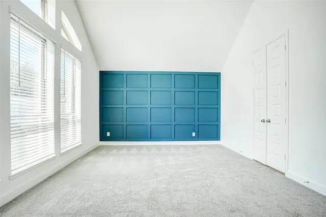 a spacious bathroom with a tub sink and mirror