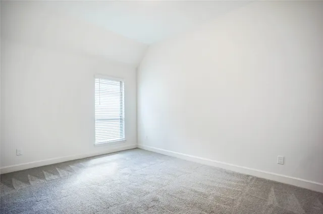 a bathroom with a granite countertop sink toilet a mirror and shower