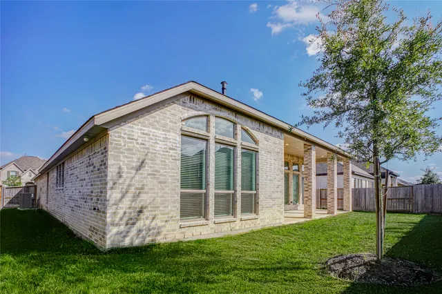 a view of entrance gate with wooden fence