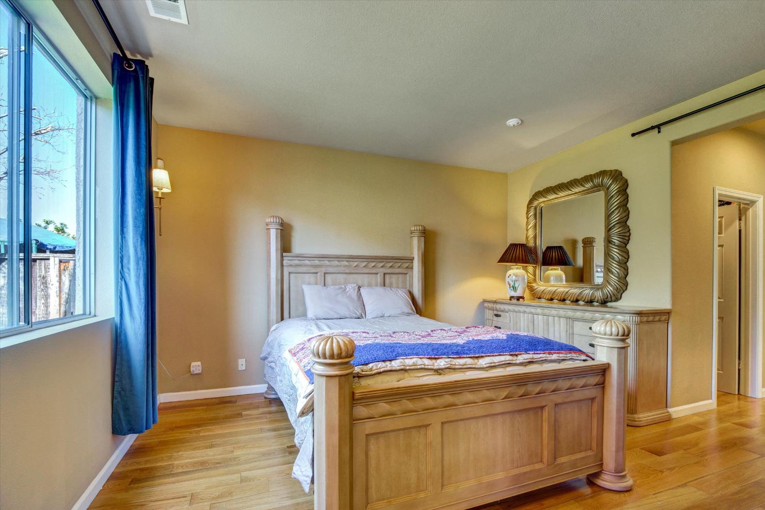 30253 Oakbrook Road Hayward, CA 94544 - Photo 15 of 49 a bedroom with a bed and wooden floor