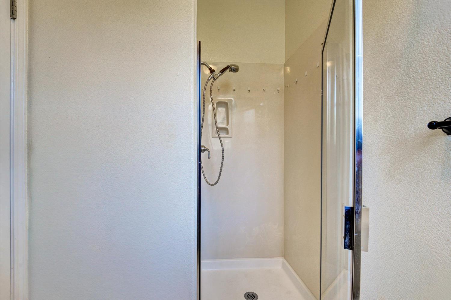 30253 Oakbrook Road Hayward, CA 94544 - Photo 17 of 49 a bathroom with a glass shower door
