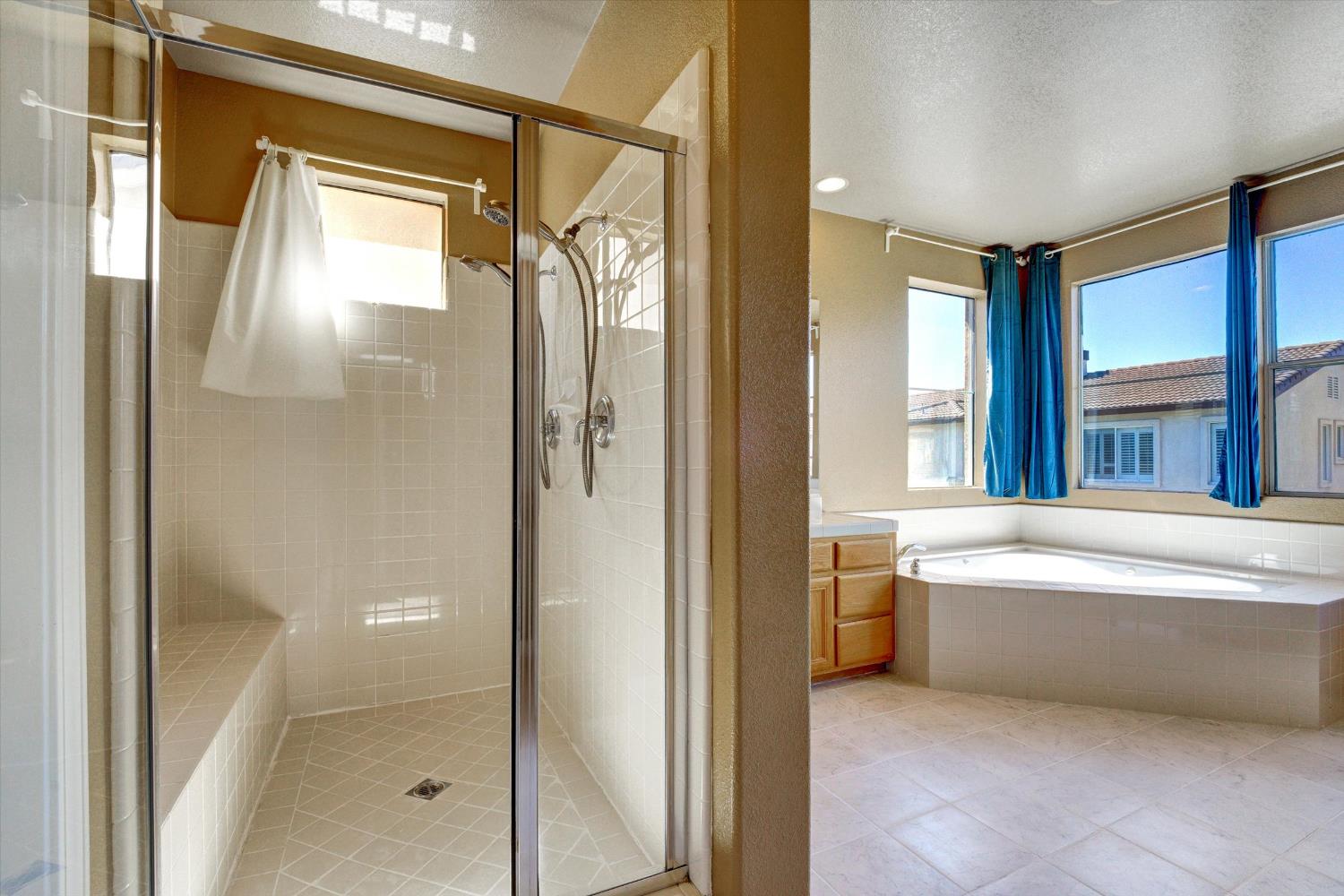 30253 Oakbrook Road Hayward, CA 94544 - Photo 31 of 49 a bathroom with a bathtub and a shower