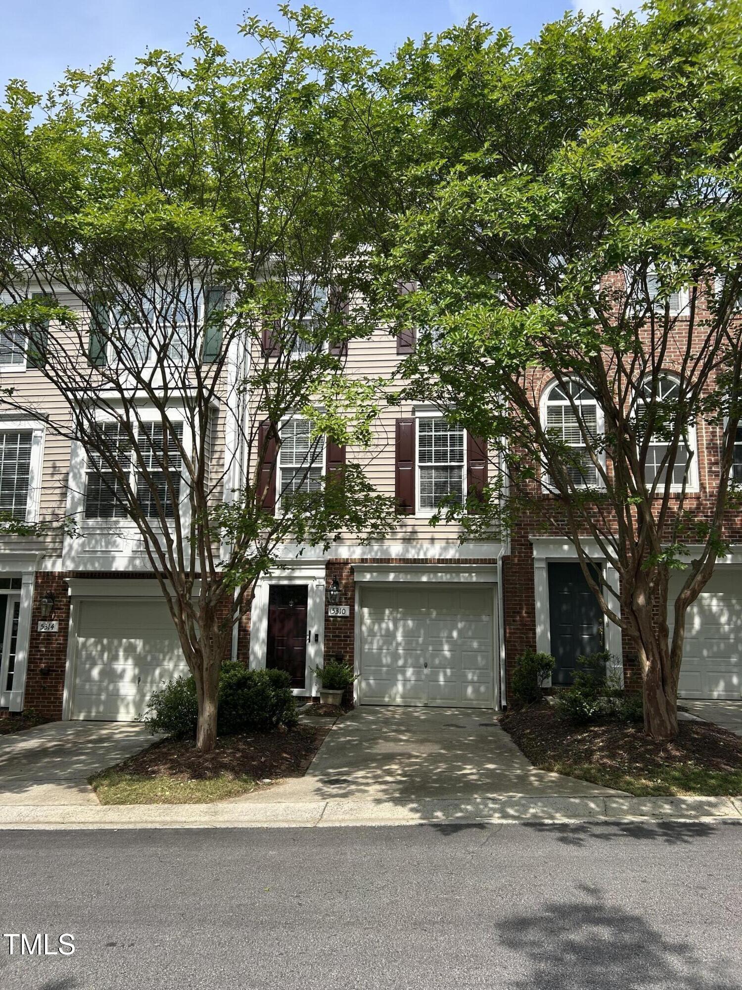 5310 Echo Ridge Road Raleigh, NC 27612 - Photo 1 of 29 a view of a house with a yard and large tree