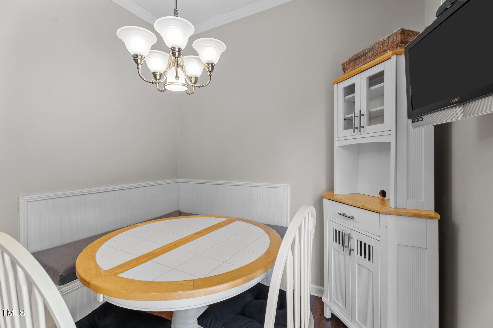 5310 Echo Ridge Road Raleigh, NC 27612 - Photo 11 of 29 a view of a dining room with a table and chairs