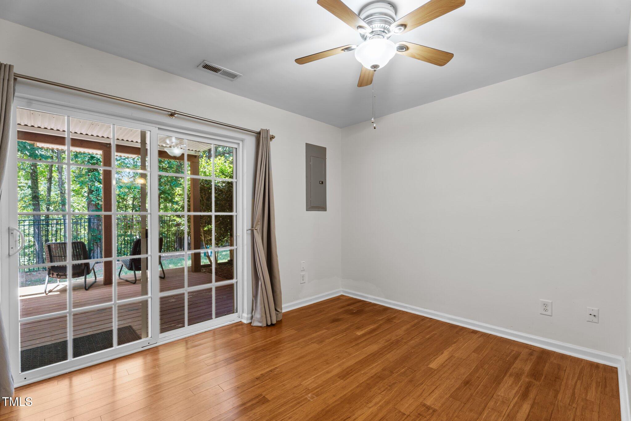 5310 Echo Ridge Road Raleigh, NC 27612 - Photo 20 of 29 an empty room with wooden floor and windows