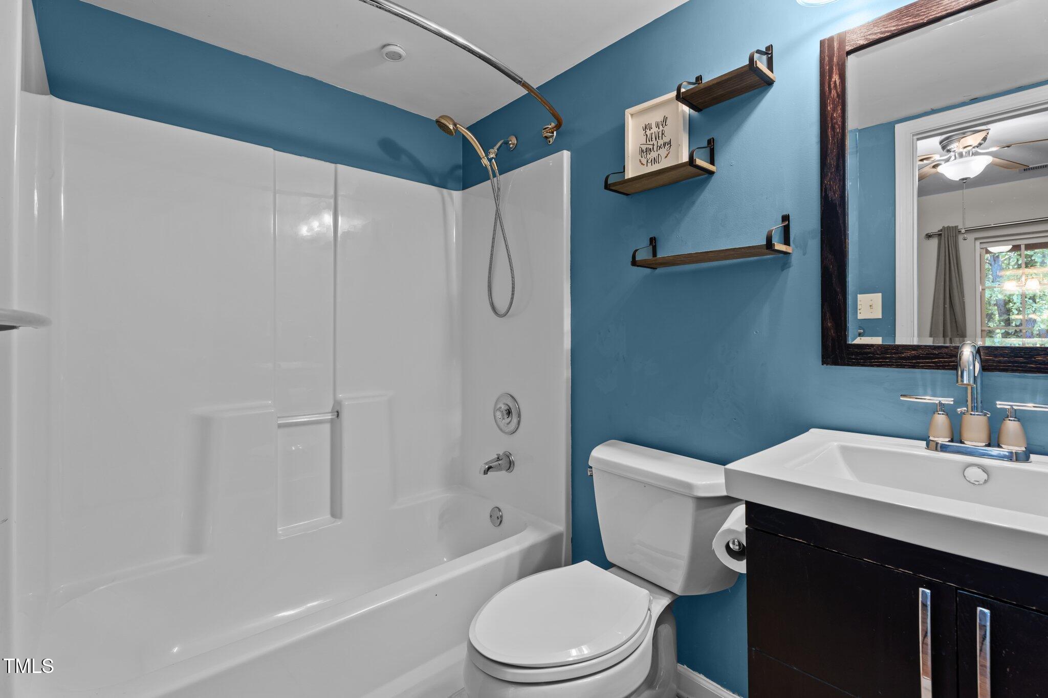 5310 Echo Ridge Road Raleigh, NC 27612 - Photo 22 of 29 a bathroom with a sink toilet and shower