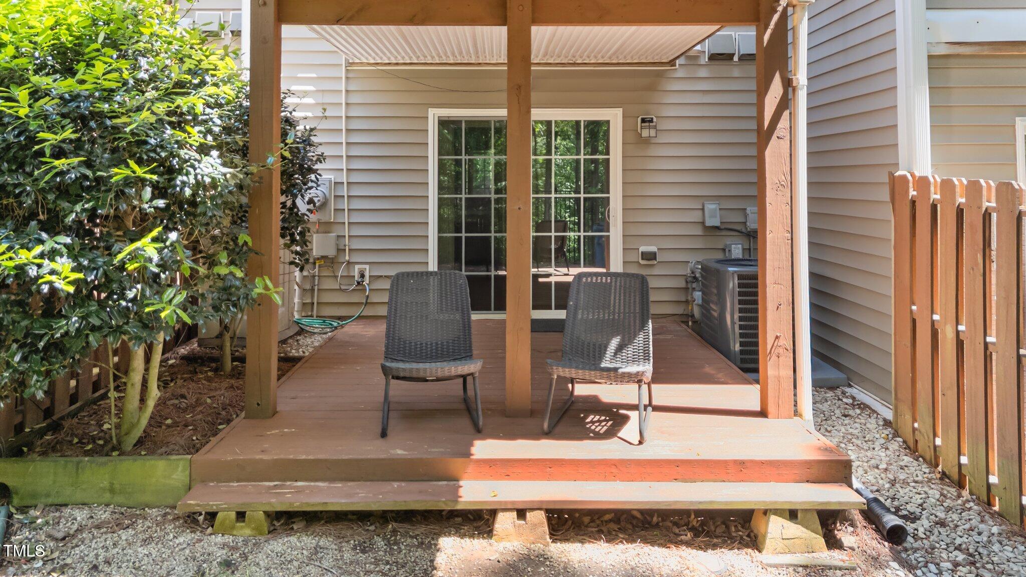 5310 Echo Ridge Road Raleigh, NC 27612 - Photo 23 of 29 a view of a chair and tables in the balcony