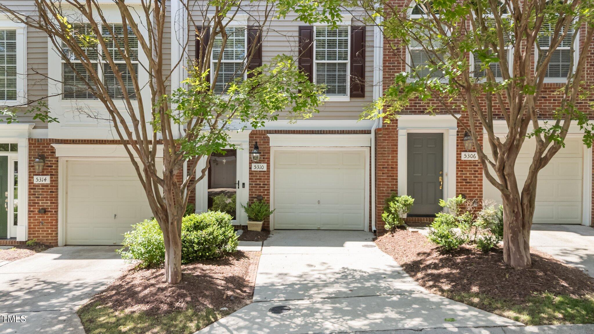 5310 Echo Ridge Road Raleigh, NC 27612 - Photo 2 of 29 a view of a pathway with a house in the background