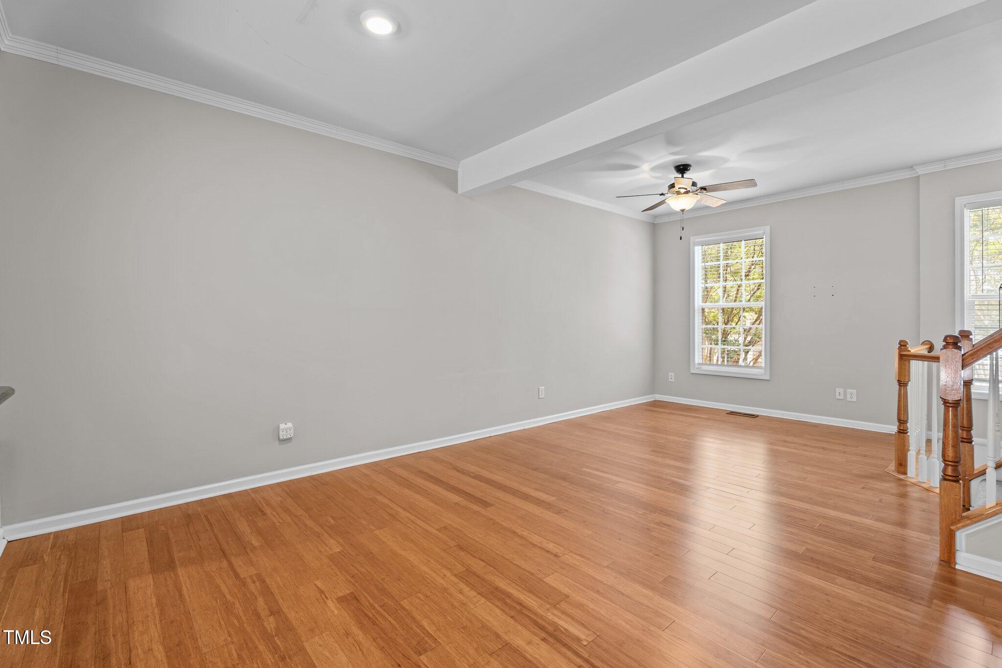 5310 Echo Ridge Road Raleigh, NC 27612 - Photo 6 of 29 wooden floor in an empty room with a window