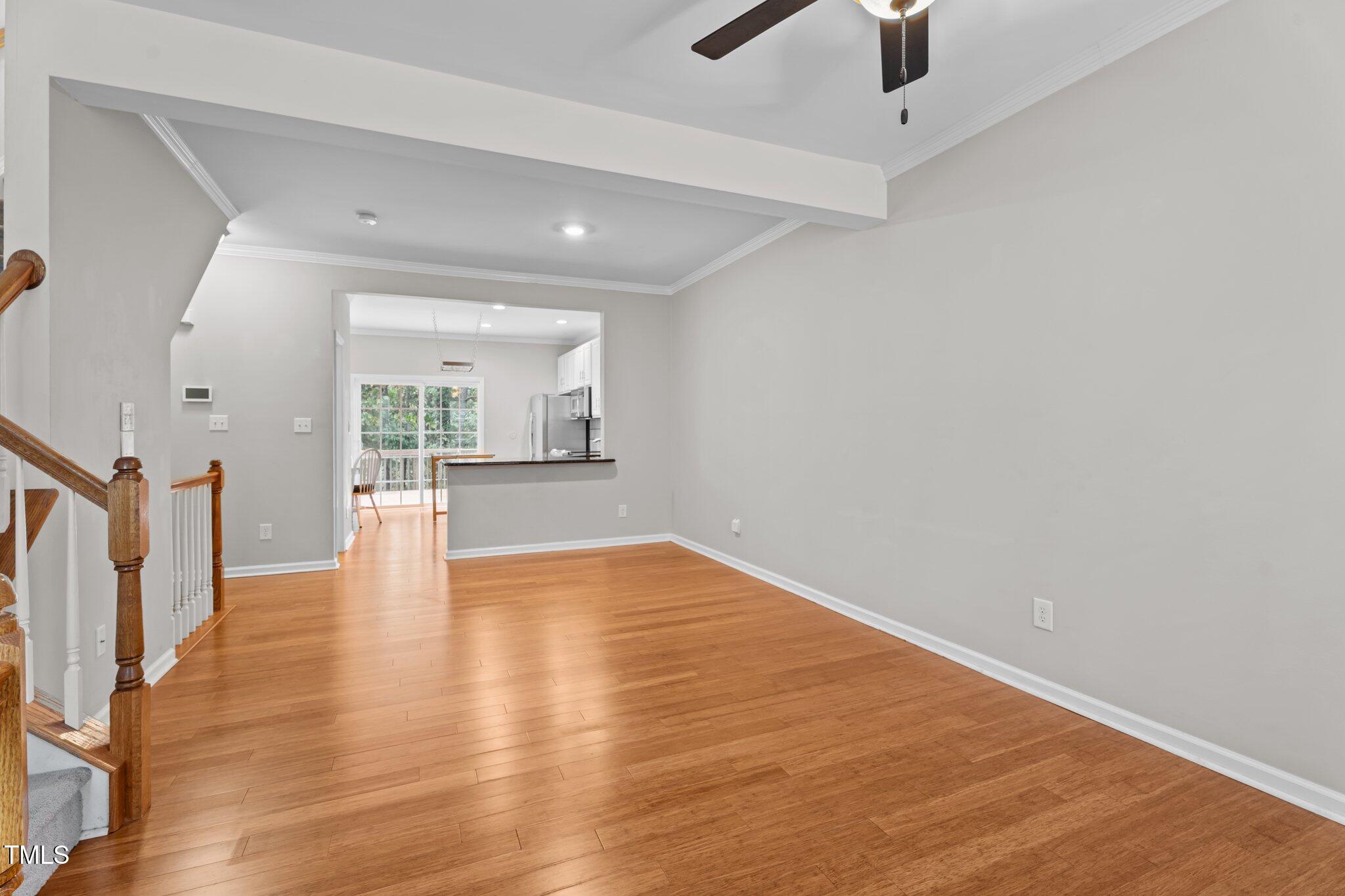 5310 Echo Ridge Road Raleigh, NC 27612 - Photo 7 of 29 wooden floor in an empty room with a window