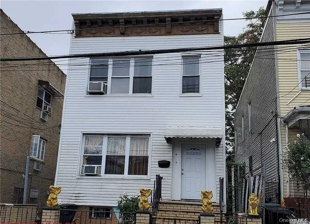 a view of a house with wooden deck
