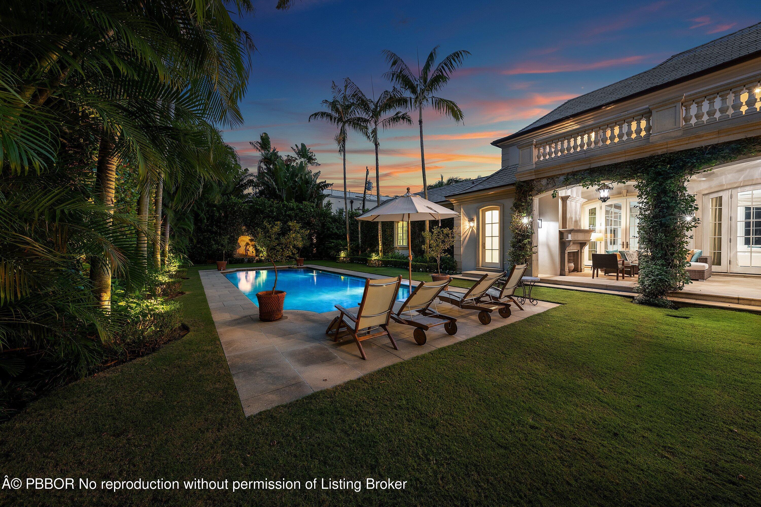 242 Wells Road Palm Beach, FL 33480 - Photo 47 of 54 a view of a backyard with a patio