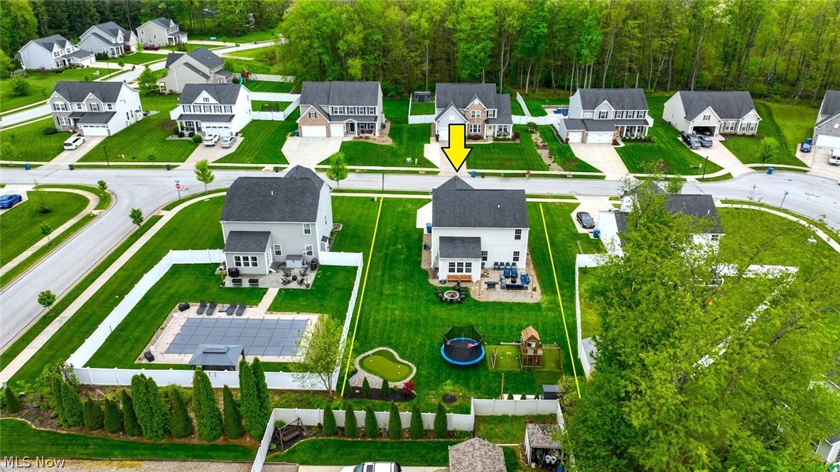 3021 Stonehurst Road Uniontown, OH 44685 - Photo 2 of 48 *VIEW OF THE GROUNDS FROM ABOVE. PUTTING GREEN, TURFED PLAYSET, STONE PATIO & FIREPIT ~
