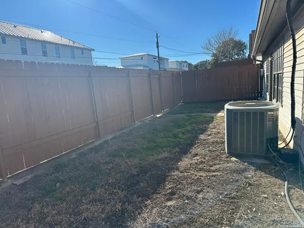 a view of backyard with tub