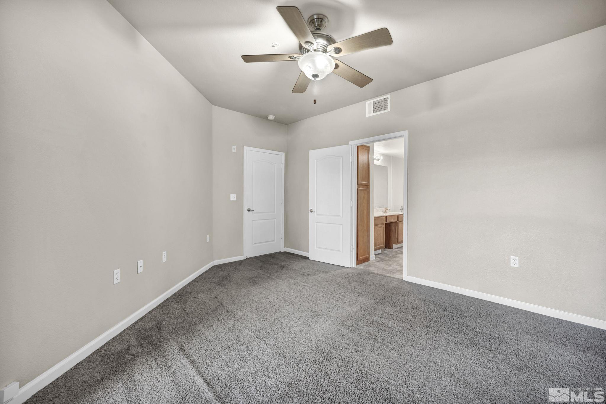 1325 South Meadows Parkway, Unit 412 Reno, NV 89521 - Photo 19 of 39 a view of an empty room with a ceiling fan