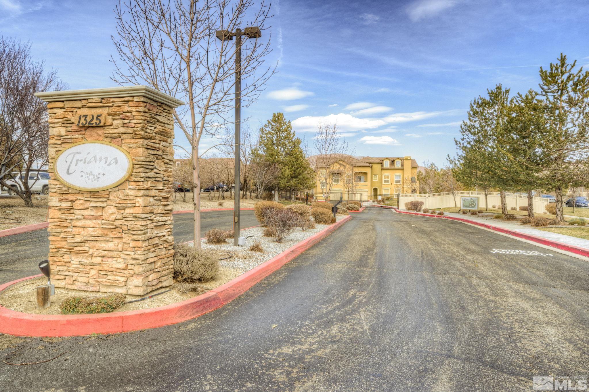 1325 South Meadows Parkway, Unit 412 Reno, NV 89521 - Photo 2 of 39 a view of a swimming pool with a yard