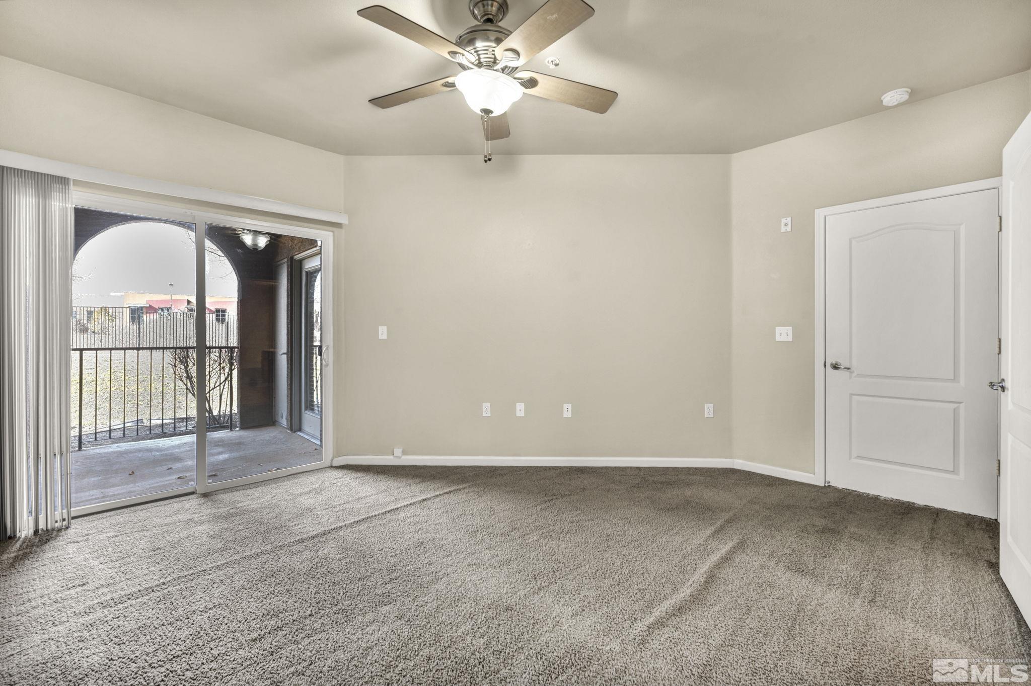 1325 South Meadows Parkway, Unit 412 Reno, NV 89521 - Photo 22 of 39 a view of a livingroom with a chandelier