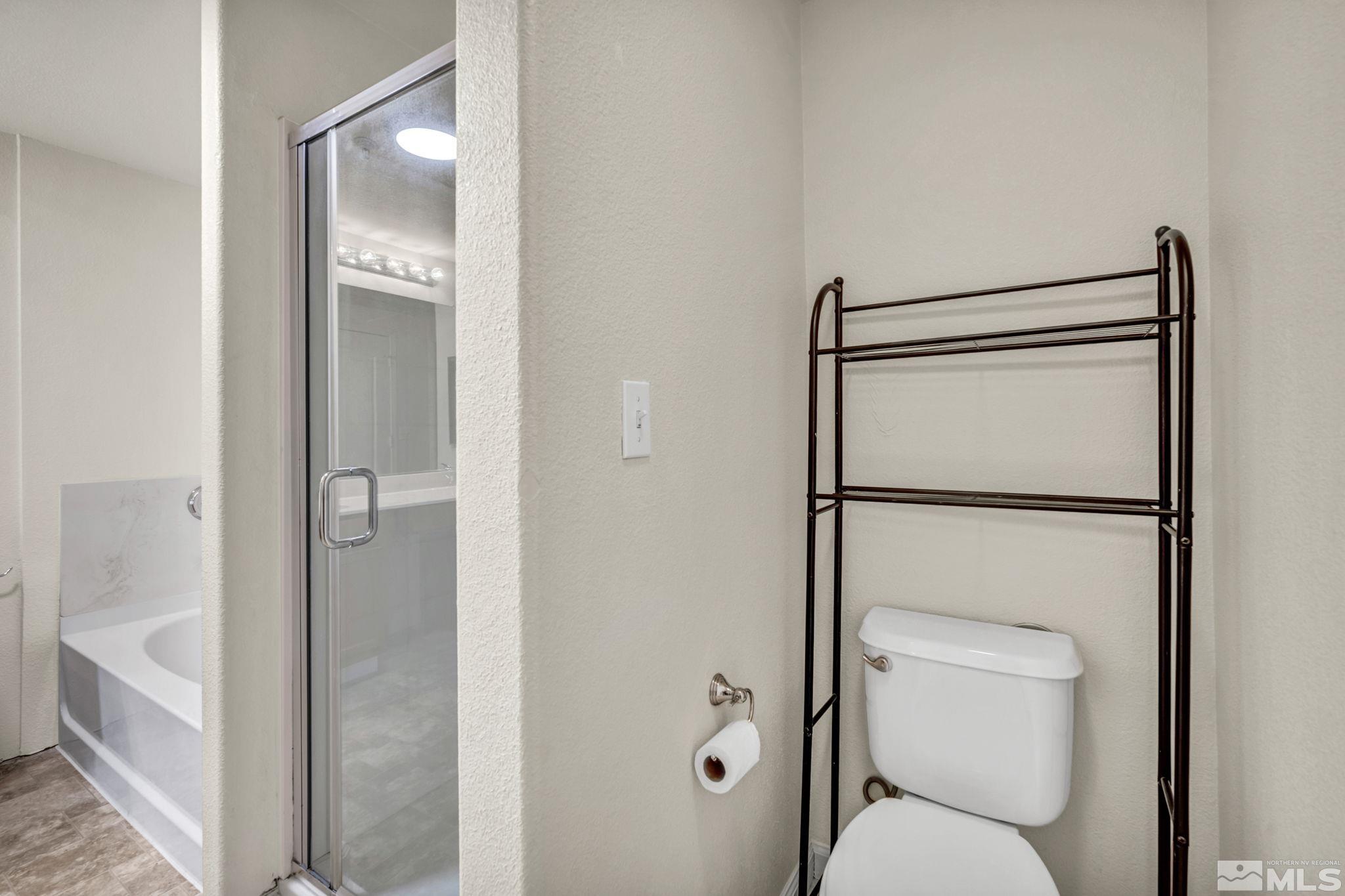 1325 South Meadows Parkway, Unit 412 Reno, NV 89521 - Photo 26 of 39 a bathroom with a shower and a toilet