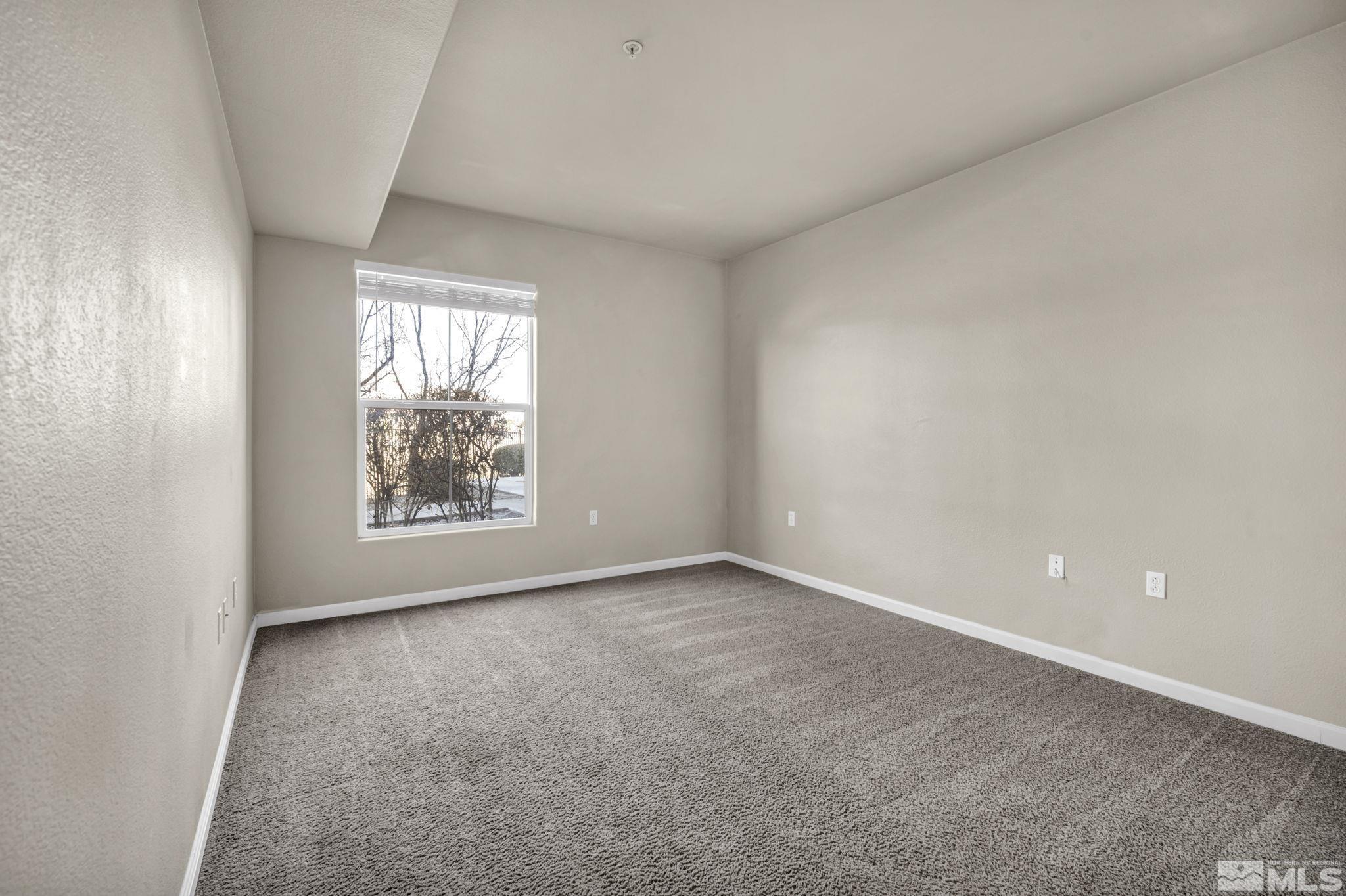 1325 South Meadows Parkway, Unit 412 Reno, NV 89521 - Photo 28 of 39 an empty room with windows
