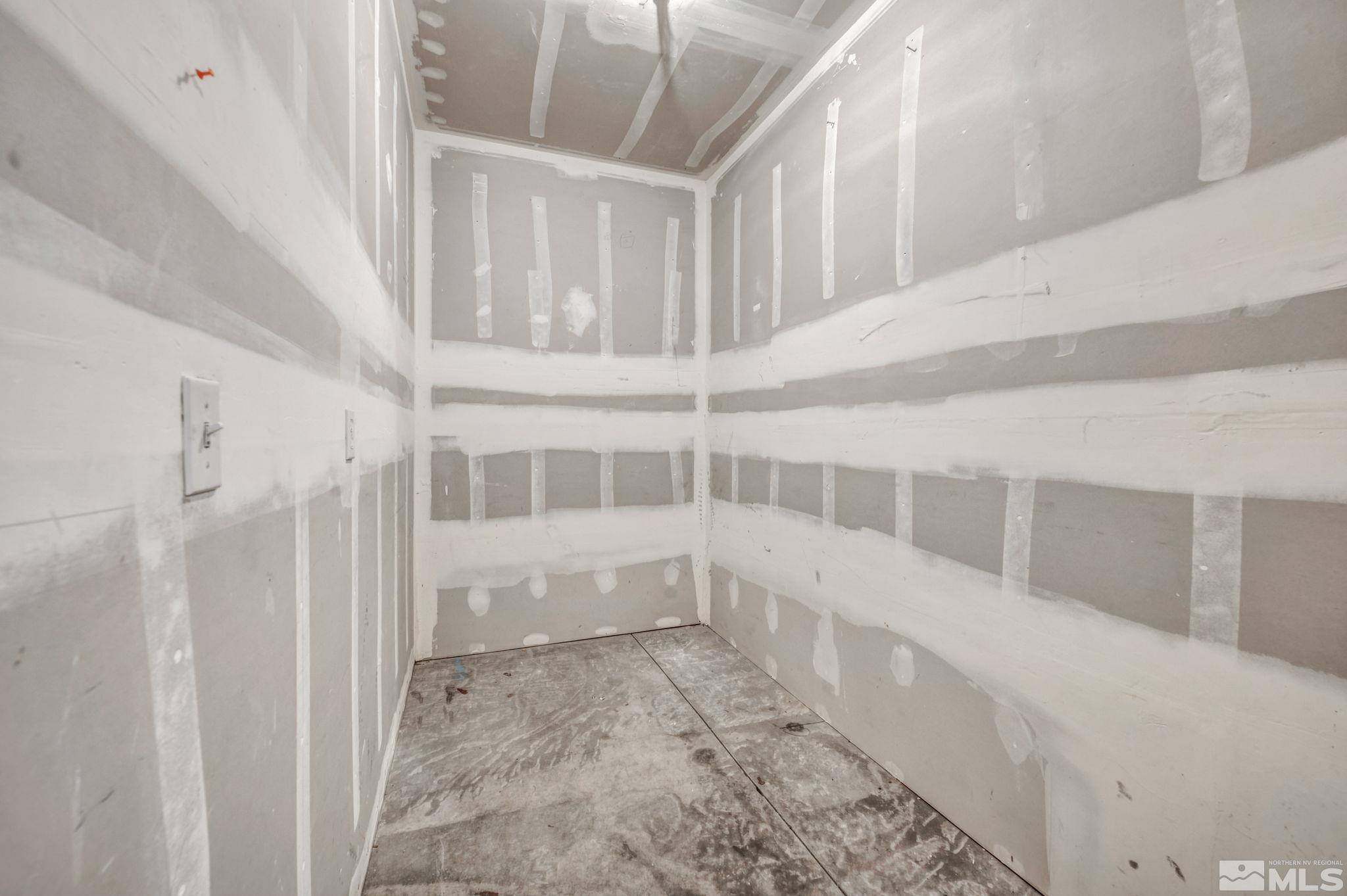 1325 South Meadows Parkway, Unit 412 Reno, NV 89521 - Photo 35 of 39 a view of staircase with white walls and a window