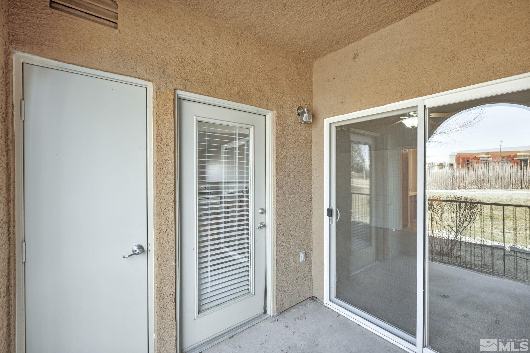 1325 South Meadows Parkway, Unit 412 Reno, NV 89521 - Photo 38 of 39 a view of a bathroom with a glass door