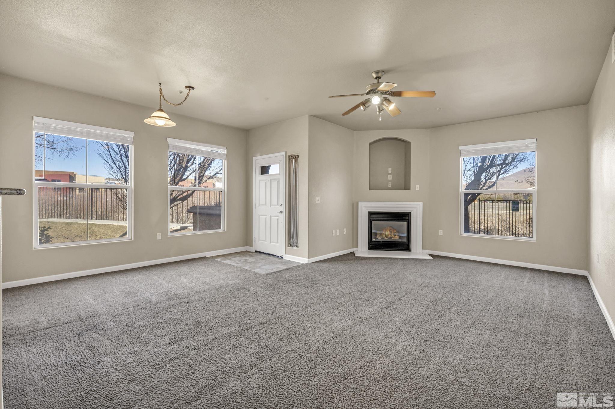1325 South Meadows Parkway, Unit 412 Reno, NV 89521 - Photo 6 of 39 a view of livingroom window fireplace