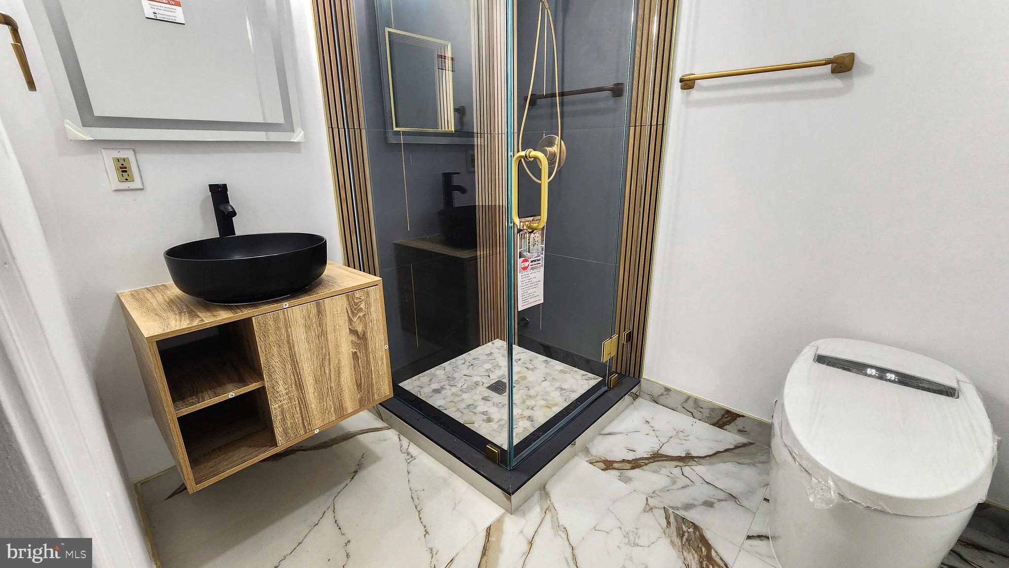 2154 Gorton Road Macungie, PA 18062 - Photo 36 of 49 a bathroom with a sink a toilet and a mirror