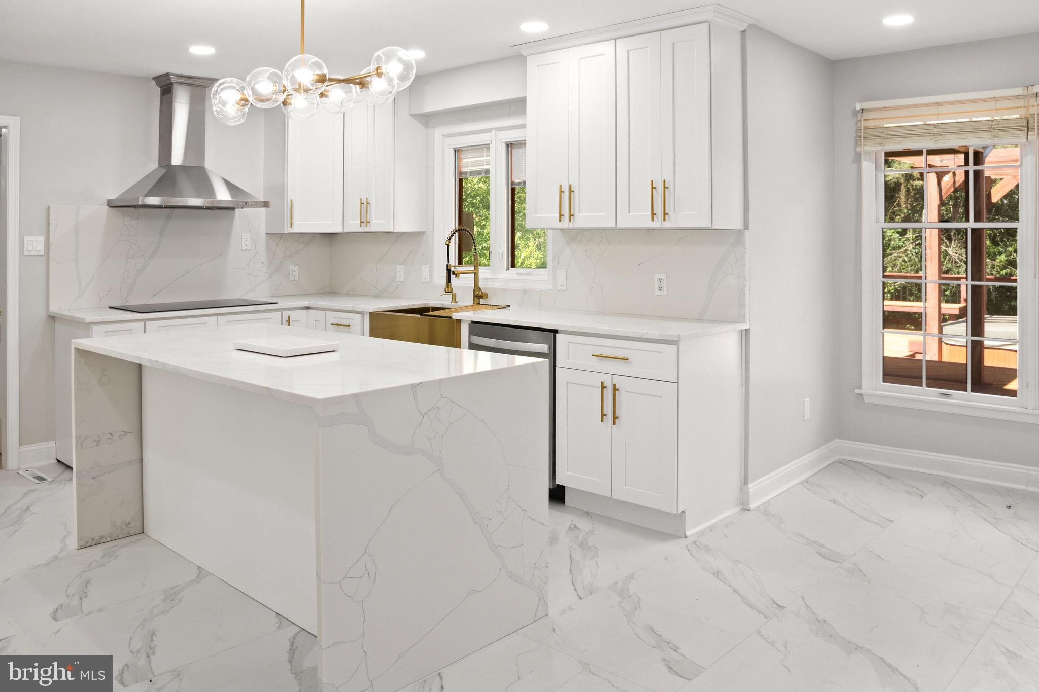 2154 Gorton Road Macungie, PA 18062 - Photo 10 of 49 a kitchen with kitchen island granite countertop a sink cabinets and window