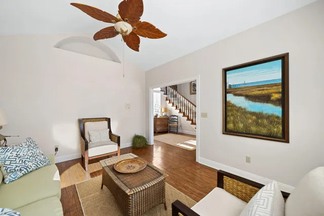 a living room with furniture and a table