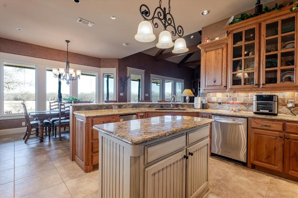 11918 Riek Road Krum, TX 76249 - Photo 11 of 39 a kitchen with a counter space cabinets and appliances
