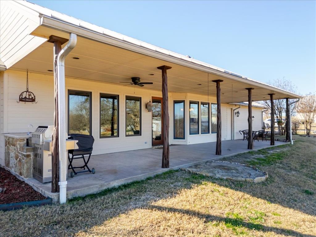 11918 Riek Road Krum, TX 76249 - Photo 28 of 39 a view of a house with backyard porch and sitting area