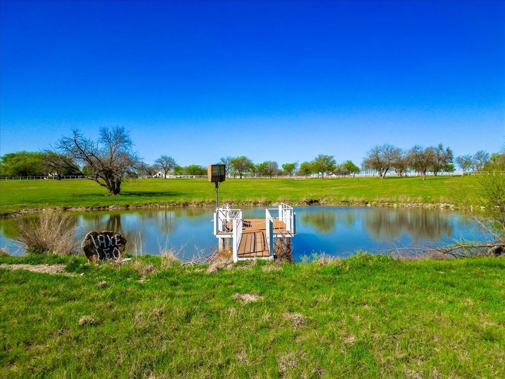11918 Riek Road Krum, TX 76249 - Photo 37 of 39 a view of a lake with a big yard