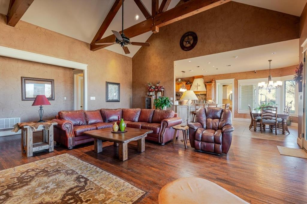 11918 Riek Road Krum, TX 76249 - Photo 9 of 39 a living room with furniture and a large window