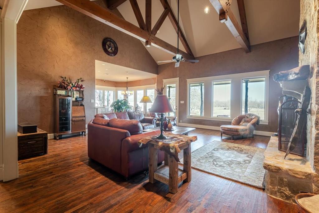 11918 Riek Road Krum, TX 76249 - Photo 10 of 39 a living room with furniture and a flat screen tv
