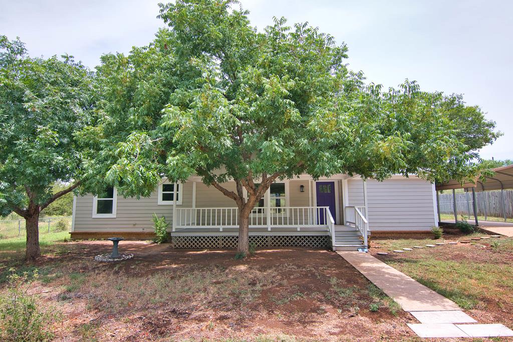 a house view with a backyard space