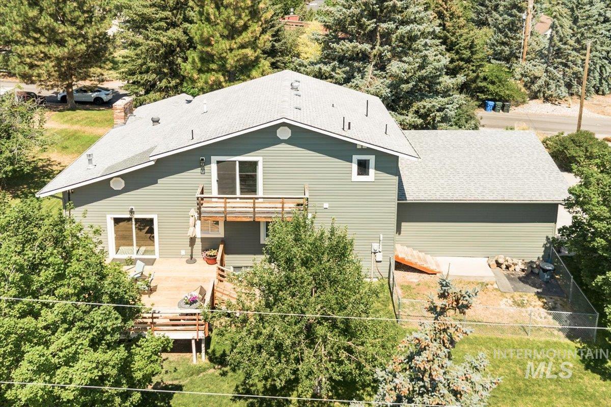 1401 Chokecherry Drive Pocatello, ID 83204 - Photo 41 of 46 Rear exterior featuring two levels of wood decking, horizontal siding, and a light-colored shingle roof