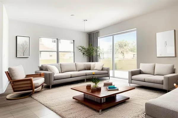 a living room with furniture a rug and a large window