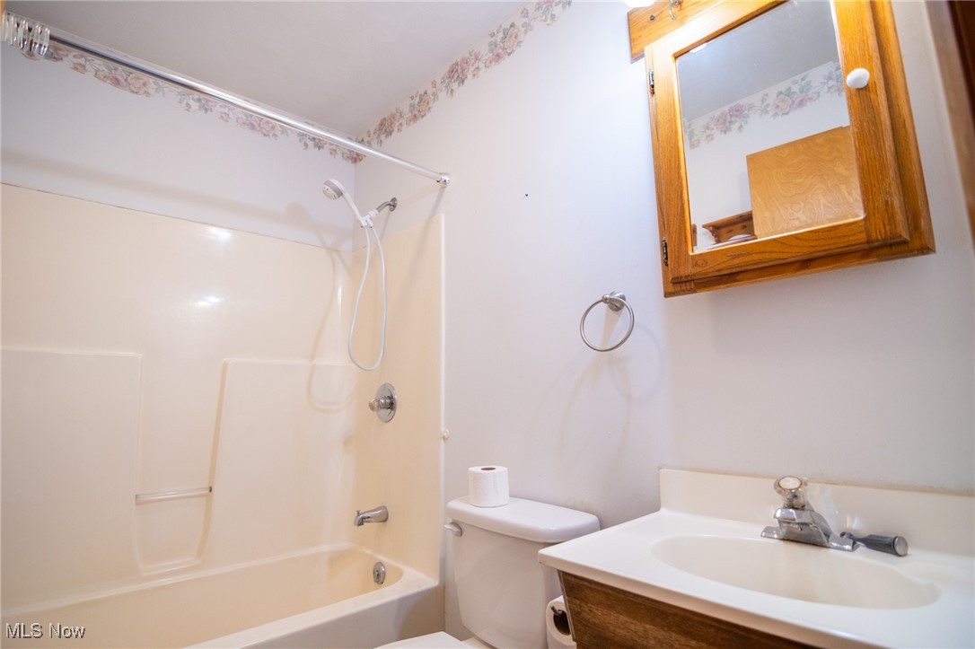 54346 Bracken Road Bridgeport, OH 43912 - Photo 26 of 50 Full bathroom with toilet, shower / tub combination, and vanity