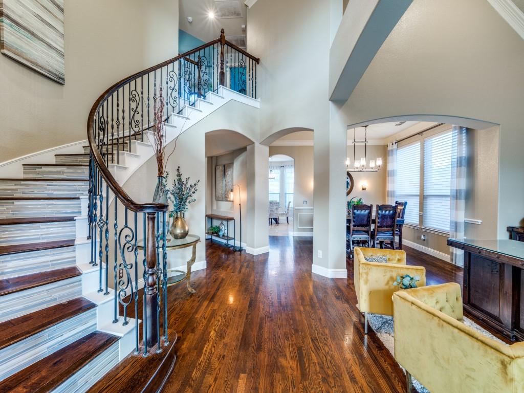 a view of entryway livingroom and hall with wooden floor