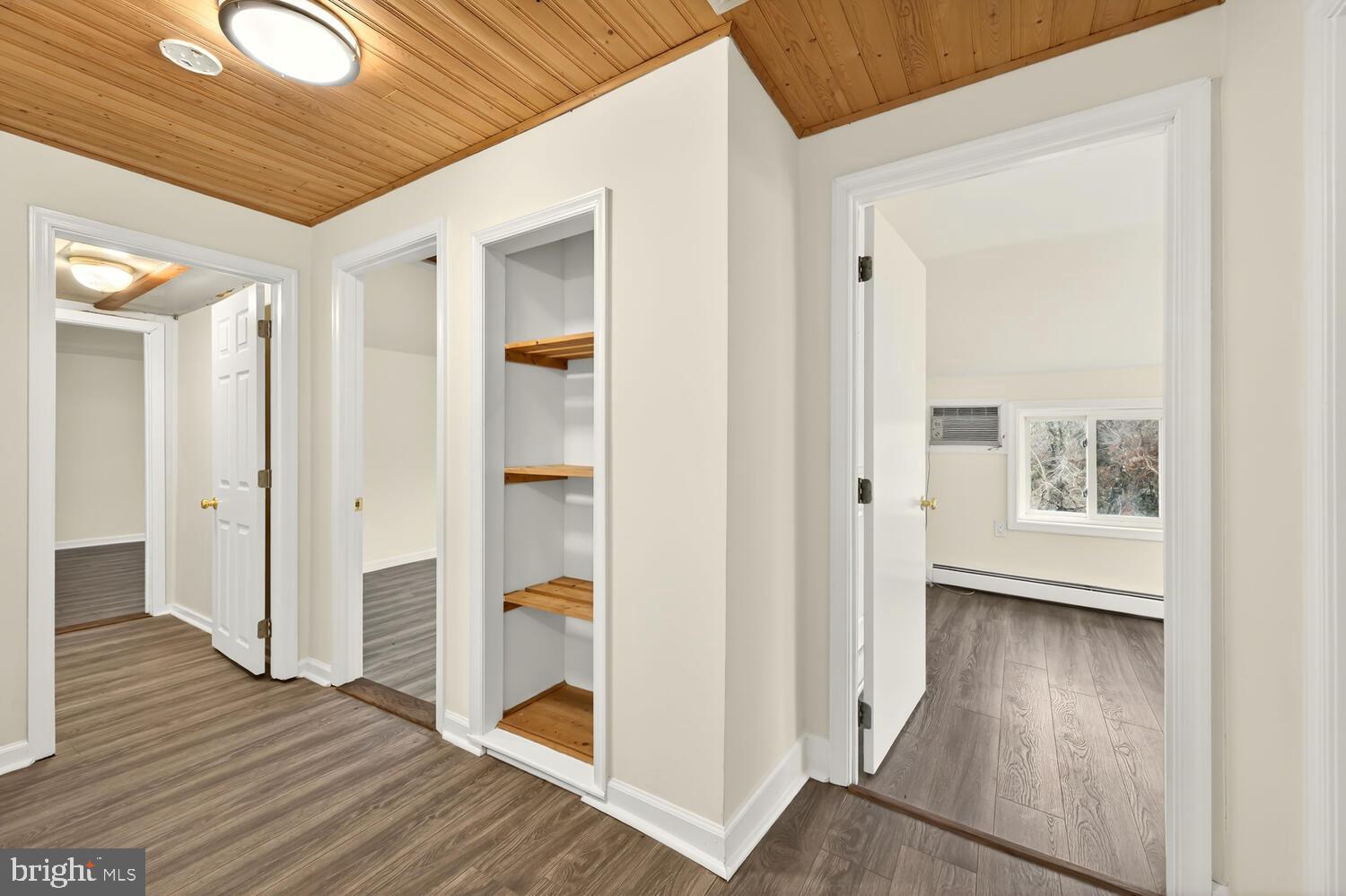 6746 Quaker Neck Road Chestertown, MD 21620 - Photo 42 of 50 a view of a hallway with wooden floor and closet