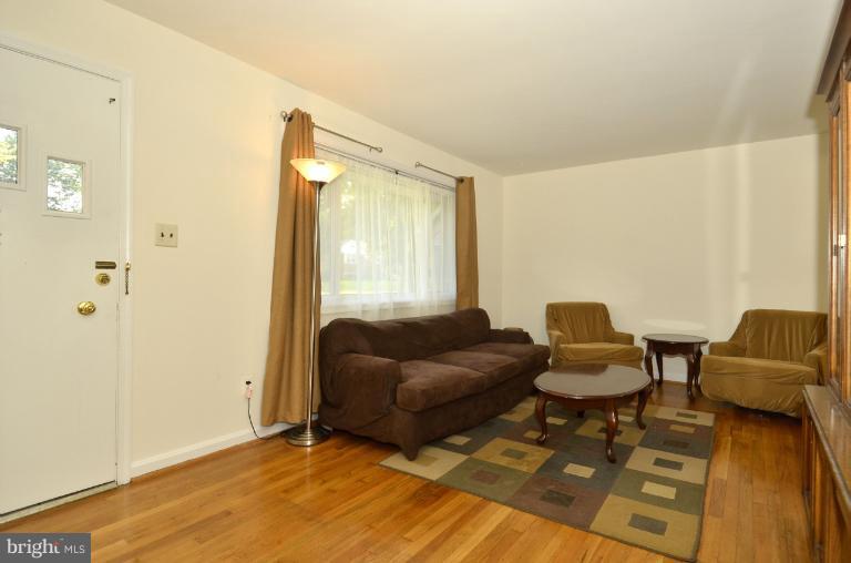 6911 Gilbert Street Springfield, VA 22150 - Photo 11 of 30 a living room with furniture and a window