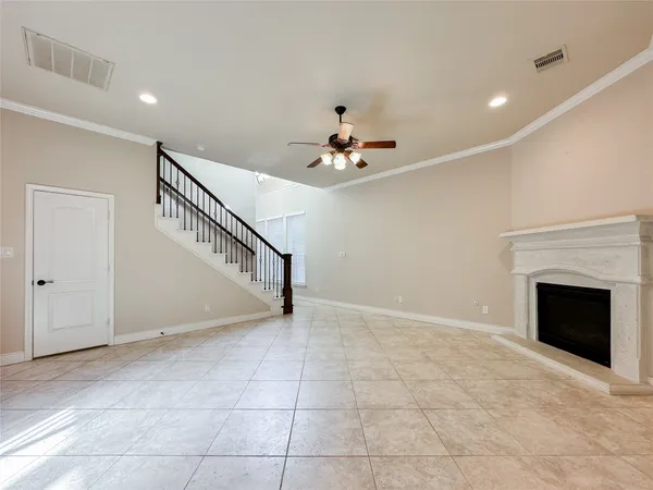 a view of an empty room with a fireplace