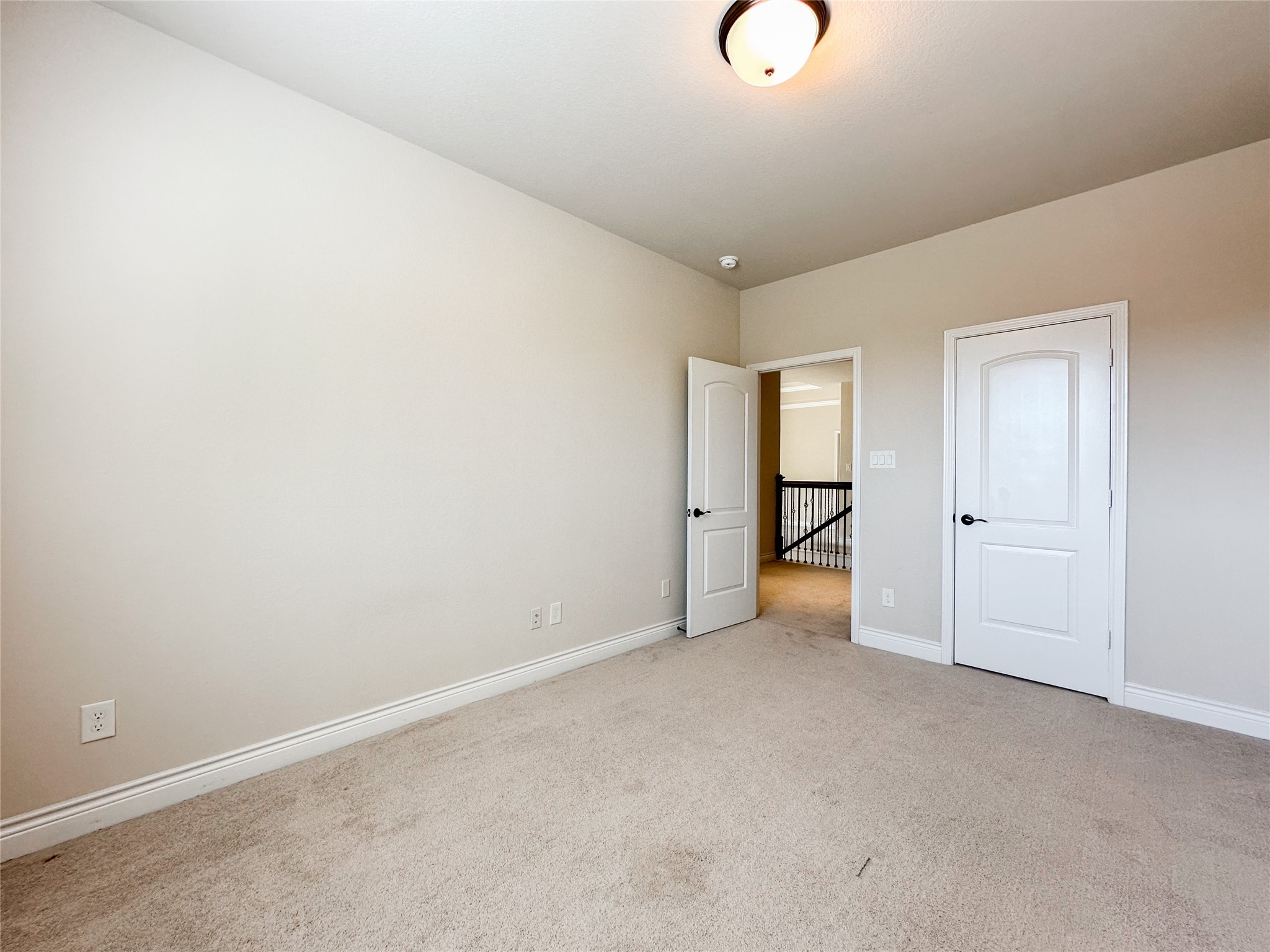 23 Jonquil Place Tomball, TX 77375 - Photo 35 of 50 a view of an empty room with wooden floor