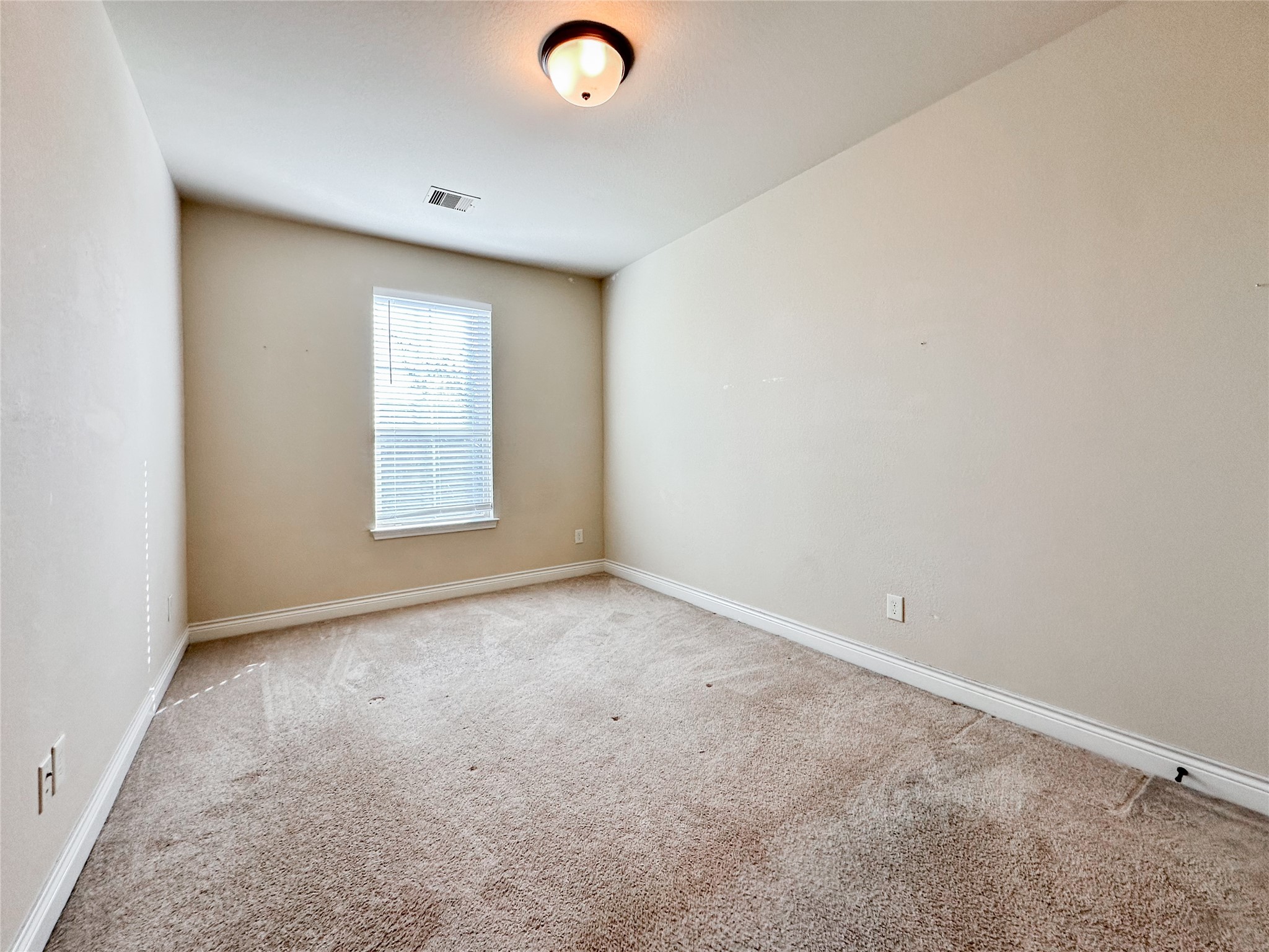 23 Jonquil Place Tomball, TX 77375 - Photo 36 of 50 an empty room with windows