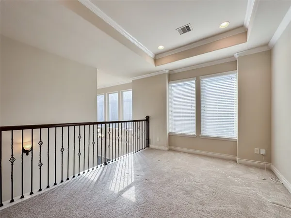 a view of hallway with windows