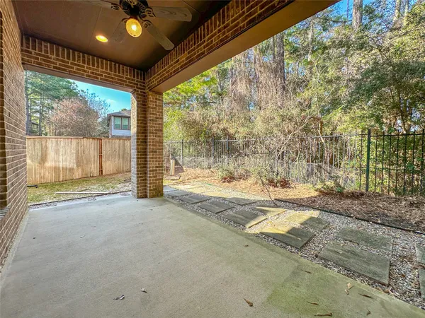a view of a house with a backyard and floor to ceiling window
