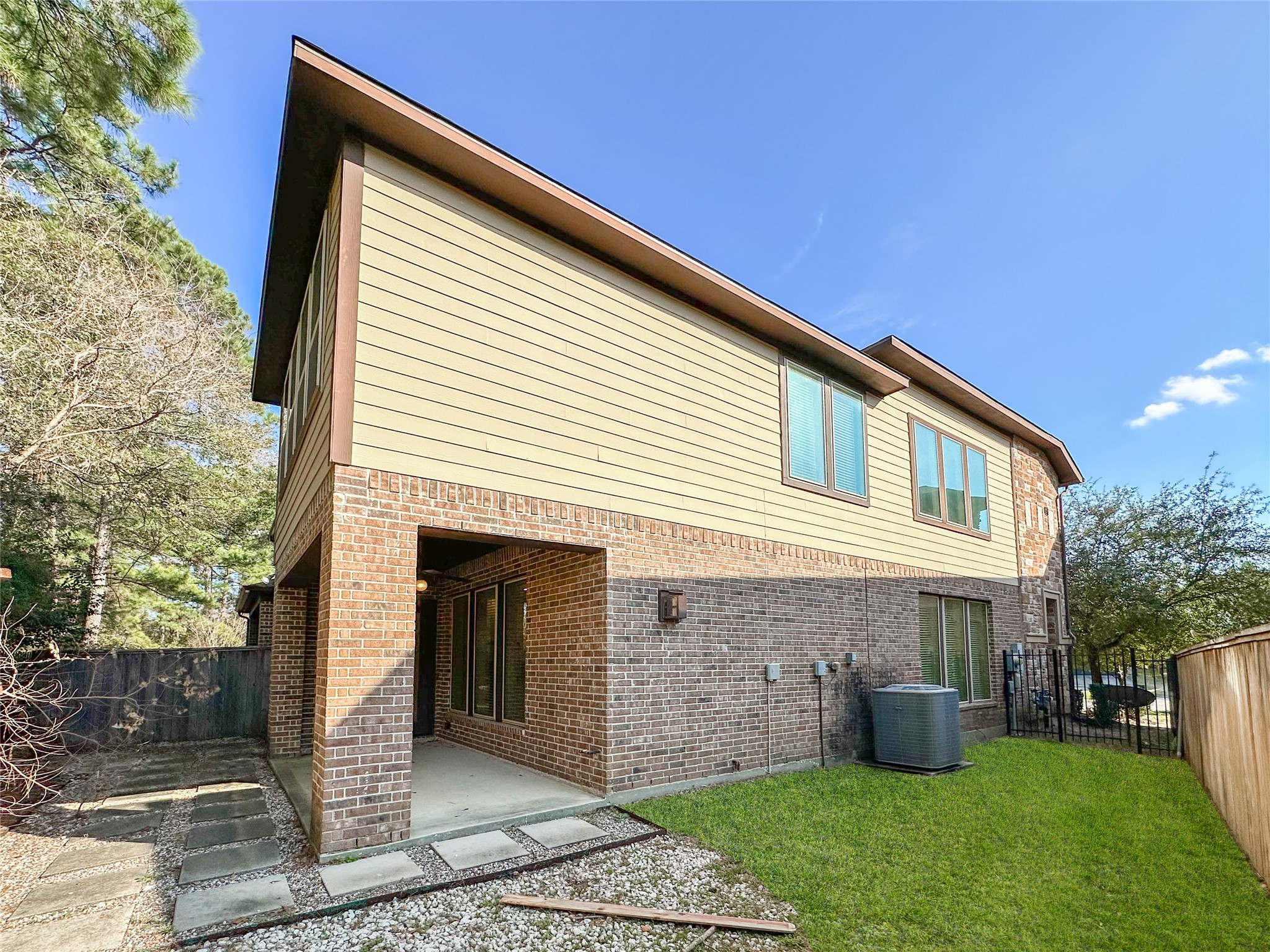 23 Jonquil Place Tomball, TX 77375 - Photo 47 of 50 a front view of a house with a yard